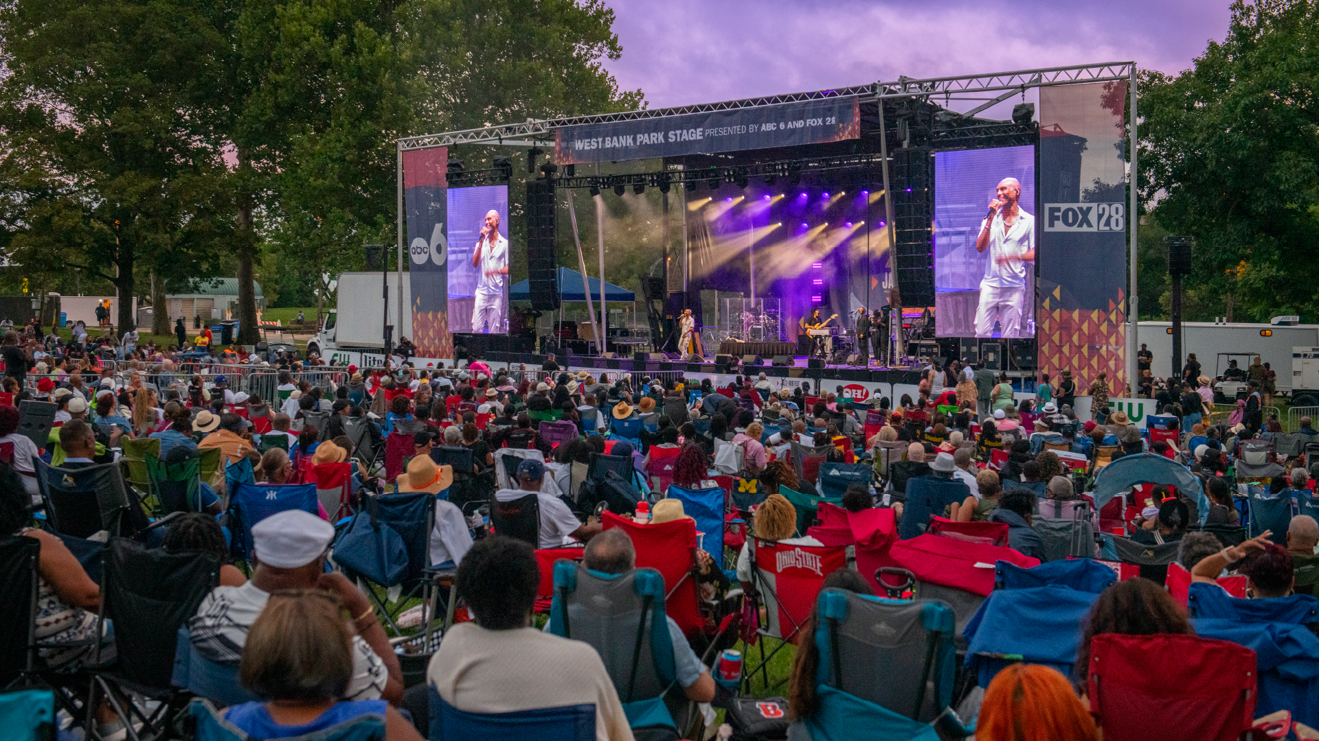 The West Bank Park Stage, presented by ABC6 and FOX28, with a large crowd gathered to watch the headlining performance.