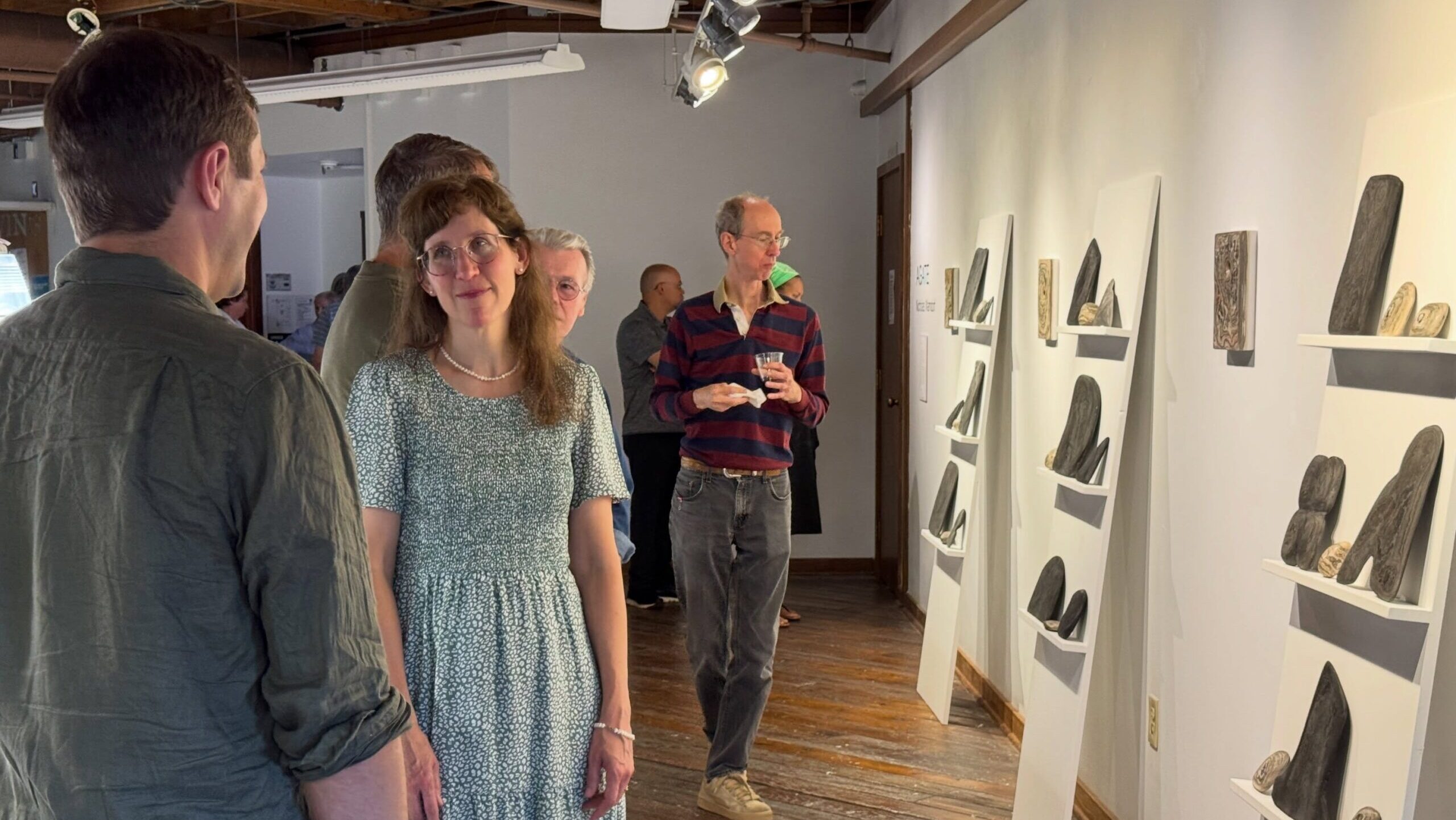 Group talking in upstairs art gallery