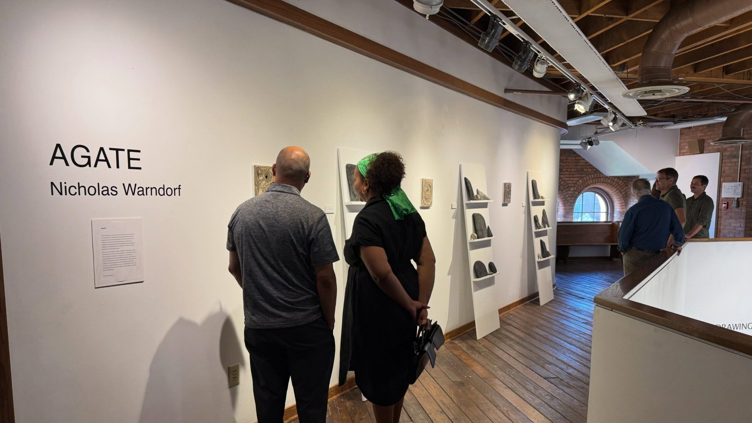 Group looking at photo in art gallery