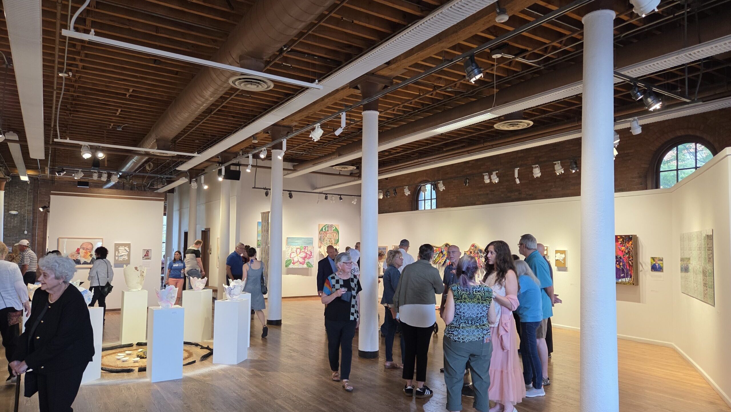 Group gather in art gallery